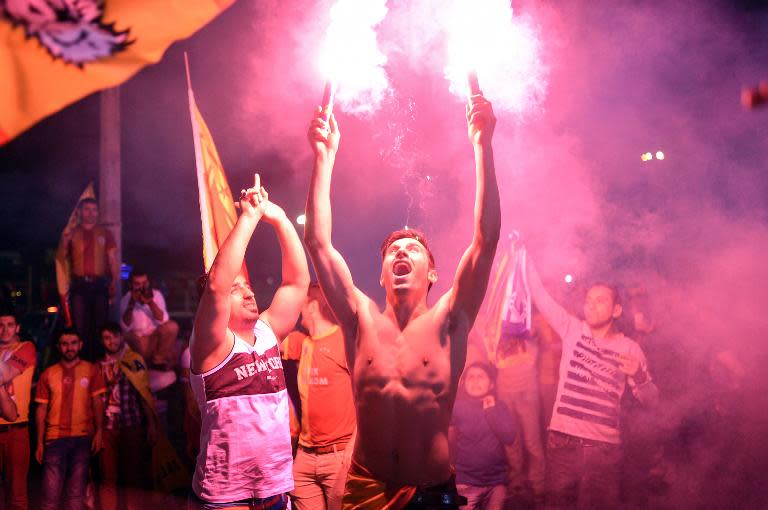 Supporters celebrate after Galatasaray were crowned champions of Turkey's top flight for a record 20th time on May 25, 2015 in Istanbul