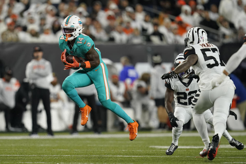 Miami Dolphins' Trent Sherfield (14) makes a catch against Cincinnati Bengals' Germaine Pratt (57) during the second half of an NFL football game, Thursday, Sept. 29, 2022, in Cincinnati. (AP Photo/Joshua A. Bickel)