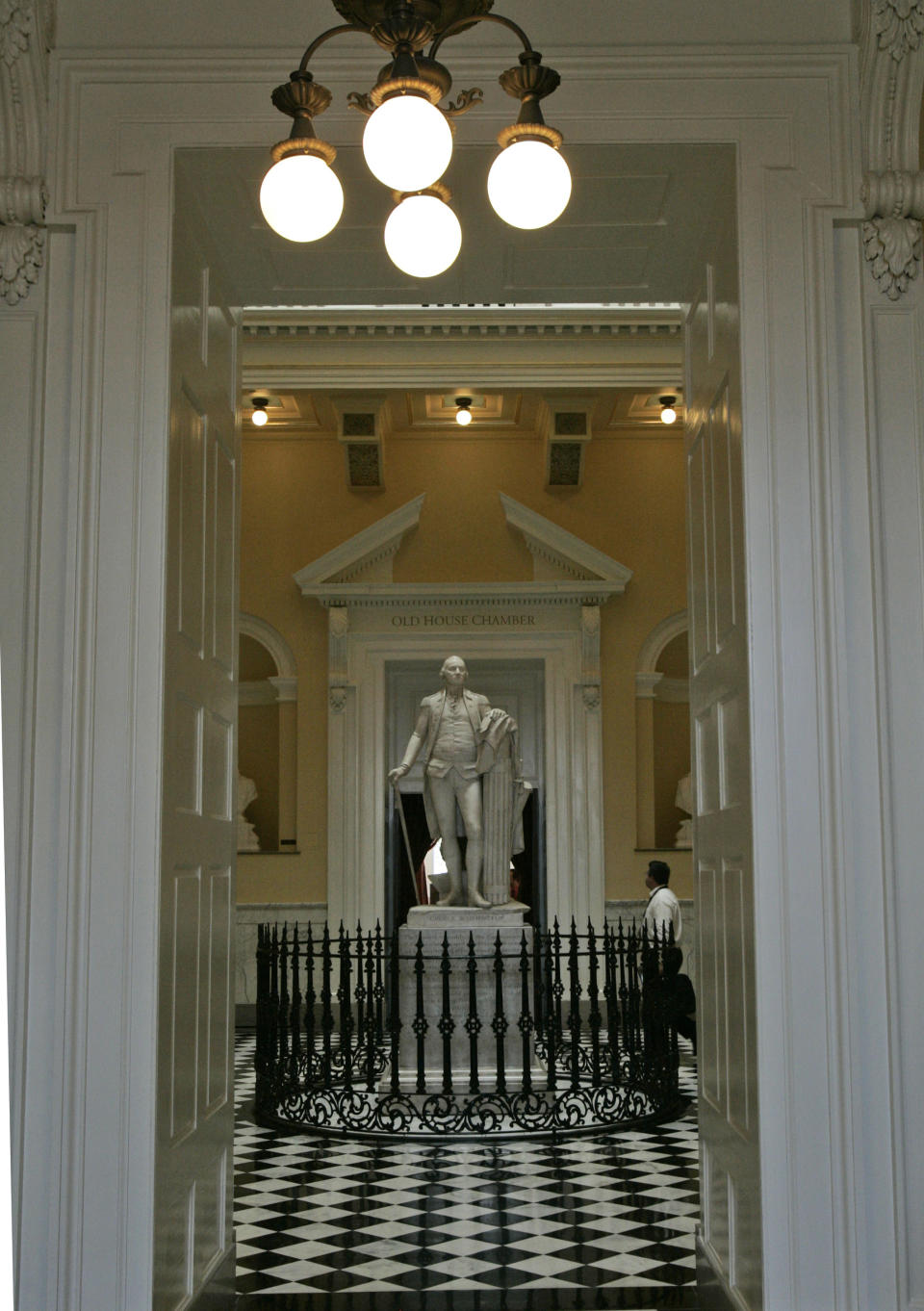 FILE - This Aug. 9, 2007 file photo shows the George Washington statue in the rotunda at the Capitol in Richmond, Va. The State Capitol building, designed by Thomas Jefferson in the Monumental Classical style, has housed state government since 1788. The wings of the building were added between 1904 and 1906. The Capitol reopened in 2007 after a $104.5 million restoration and expansion project that began in 2004. Statues of Virginia historic figures dot the grounds. (AP Photo/Steve Helber, File)