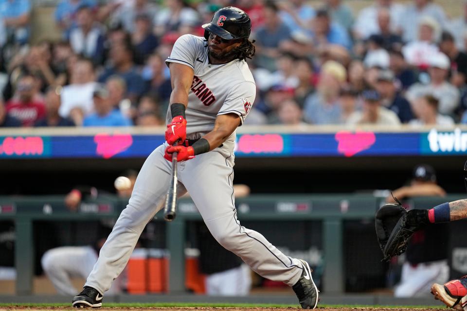 Cleveland Guardians'  Josh Bell hits an RBI-single during the sixth inning of a baseball game against the Minnesota Twins, Thursday, June 1, 2023, in Minneapolis.  (AP Photo/Abbie Parr)