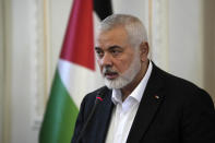 Hamas chief Ismail Haniyeh speaks during a press briefing after his meeting with Iranian Foreign Minister Hossein Amirabdollahian in Tehran, Iran, Tuesday, March 26, 2024. The chief prosecutor of the International Criminal Court said Monday he is seeking arrest warrants for Israeli and Hamas leaders, including Israeli Prime Minister Benjamin Netanyahu, in connection with their actions during the seven-month war between Israel and Hamas. Haniyeh is one of the three Hamas leaders believed to be responsible for war crimes and crimes against humanity in the Gaza Strip and Israel. (AP Photo/Vahid Salemi, File)