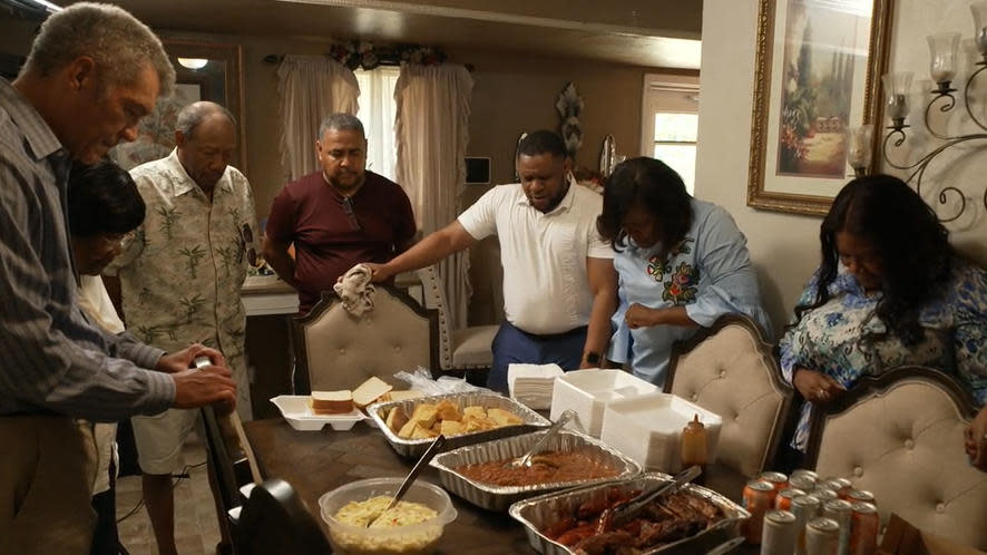 Saying Grace with the extended family.  / Credit: CBS News