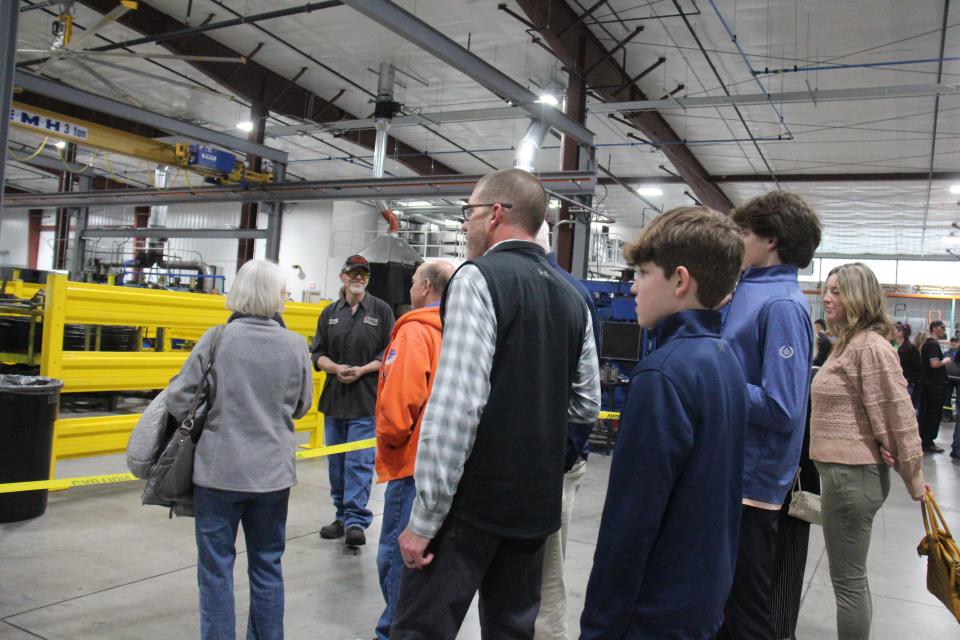 Residents get a look inside Iowa Spring Manufacturing's new facility during an open house on Thursday, April 20, 2023, in Adel.