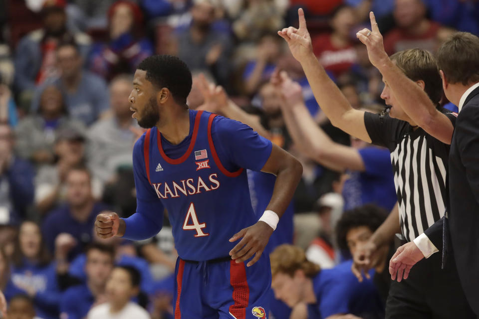 Kansas guard Isaiah Moss (4) runs upcourt after shooting a three-point basket against Stanford during the second half of an NCAA college basketball game in Stanford, Calif., Sunday, Dec. 29, 2019. (AP Photo/Jeff Chiu)