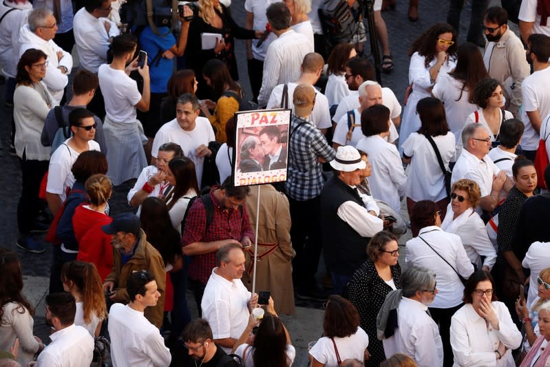 Members of Civic group Hablemos-Parlem (Let's talk) attend a rally in front of the Palau de la Generalitat at Sant Jaume square in Barcelona