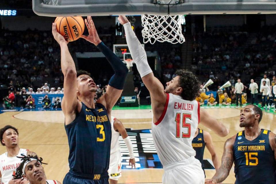 West Virginia forward Tre Mitchell (3) goes up for a shot as Maryland forward Patrick Emilien (15) defends in the first half of a first-round NCAA Tournament game in Birmingham, Ala., on March 16.