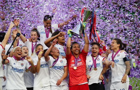Soccer Football - Women's Champions League Final - Ferencvaros Stadium, Budapest, Hungary - May 18, 2019 Olympique Lyonnais' Sarah Bouhaddi and team mates celebrate winning the Women's Champions League with the trophy REUTERS/Lisi Niesner TPX IMAGES OF THE DAY