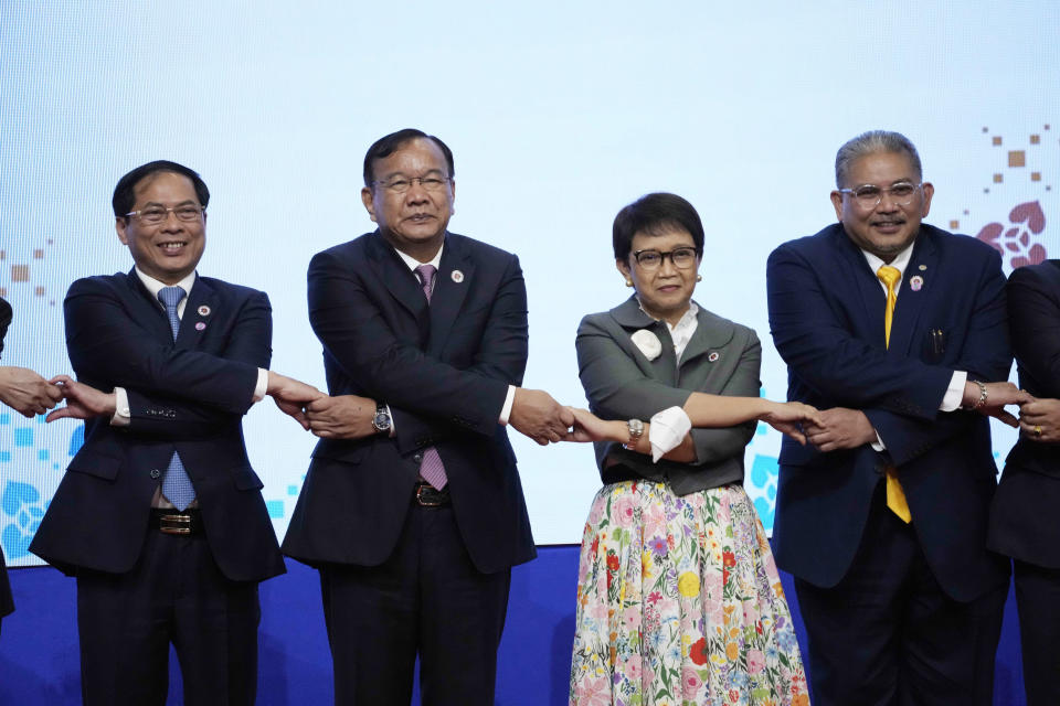 From left to right; Vietnam Foreign Minister But Thanh Son, Cambodia's Foreign Minister Peak Sokhonn, Indonesia's Foreign Minister Retno Marsudi, Brunei Second Minister of Foreign Affairs Erywan Yusof, poses for a group photograph during the Plenary Session for the 55th ASEAN Foreign Ministers' Meeting (55th AMM) in Phnom Penh, Cambodia, Wednesday, Aug. 3, 2022. Southeast Asian foreign ministers are gathering in the Cambodian capital for meetings addressing persisting violence in Myanmar and other issues, joined by top diplomats from the United States, China, Russia and other world powers amid tensions over the invasion of Ukraine and concerns over Beijing's growing ambitions in the region. (AP Photo/Heng Sinith)