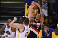 May 1, 2016; Oakland, CA, USA; Portland Trail Blazers guard C.J. McCollum (3) shoots the basketball against Golden State Warriors center Andrew Bogut (12) during the fourth quarter in game one of the second round of the NBA Playoffs at Oracle Arena. Kyle Terada-USA TODAY Sports