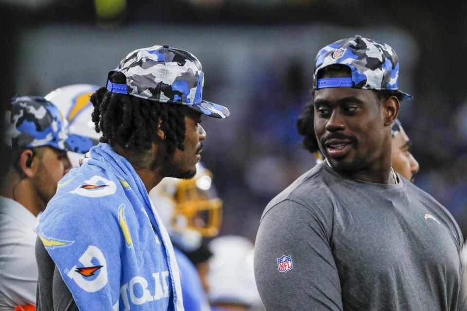 Derwin James Jr., left, talks to Sebastian Joseph-Day during the Chargers' preseason game with the Rams on Saturday.