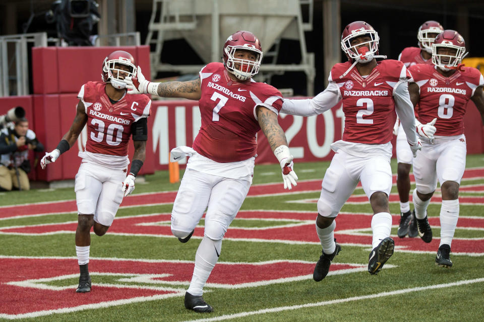 Nov 18, 2017; Fayetteville, AR, USA; Arkansas Razorbacks defensive lineman Briston Guidry (7) celebrates after recovering a fumble in the end zone for a touchdown along with defensive back Kevin Richardson II (30) and back <a class="link " href="https://sports.yahoo.com/nfl/players/32886" data-i13n="sec:content-canvas;subsec:anchor_text;elm:context_link" data-ylk="slk:Kamren Curl;sec:content-canvas;subsec:anchor_text;elm:context_link;itc:0">Kamren Curl</a> (2) and linebacker De’Jon Harris (8) at Donald W. Reynolds Razorback Stadium. Mandatory Credit: Brett Rojo-USA TODAY Sports