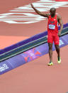 US' Lashawn Merritt waves to the crowd after pulling up from the men's 400m heats at the athletics event during the London 2012 Olympic Games on August 4, 2012 in London. AFP PHOTO / GABRIEL BOUYSGABRIEL BOUYS/AFP/GettyImages