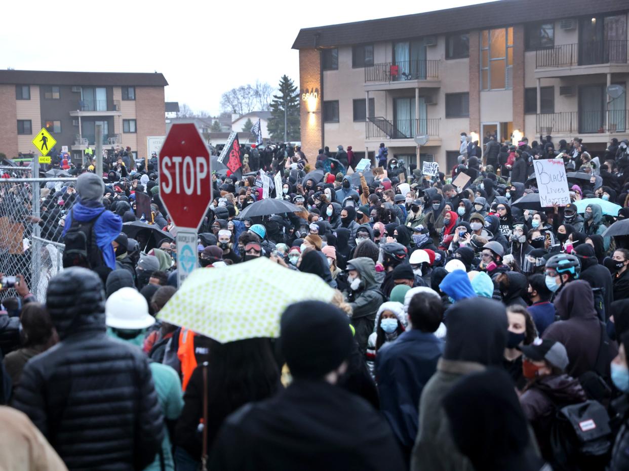 Demonstrators face off with police outside of the Brooklyn Center police station on April 12, 2021 in Brooklyn Center, Minnesota.  (Getty Images)