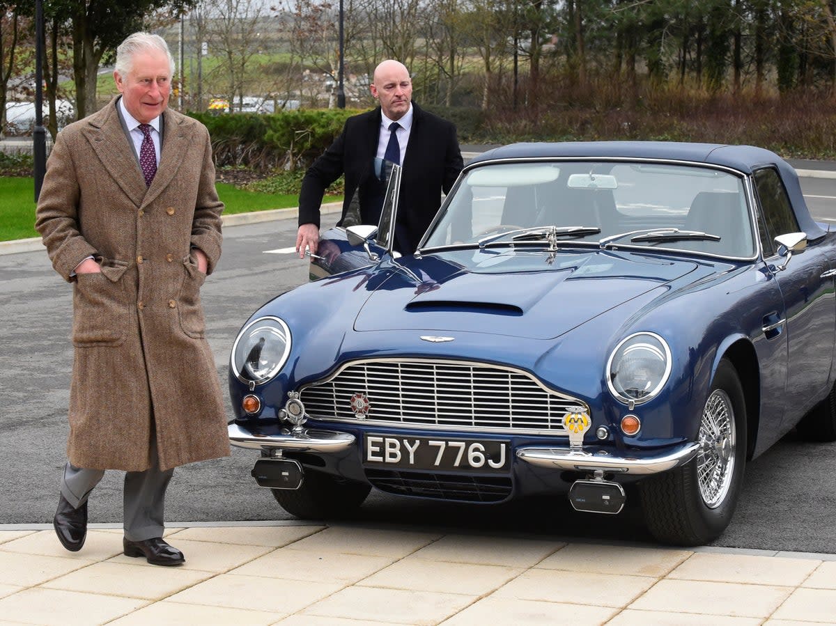 King Charles has said his Aston Martin is powered by cheese and white wine (Getty)