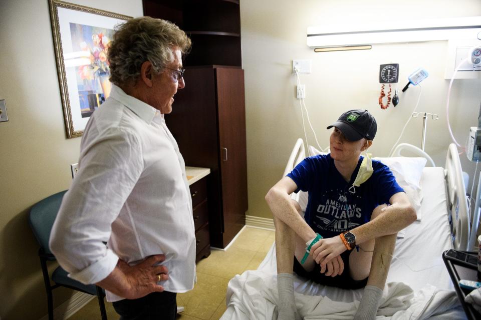 Roger Daltrey, lead singer of The Who and co-founder of Teen Cancer America, speaks with Hudson Bethea while visiting the new Hawkins Family Adolescent and Young Adult Cancer Center at St. Francis Downtown on Tuesday in Greenville, S.C.