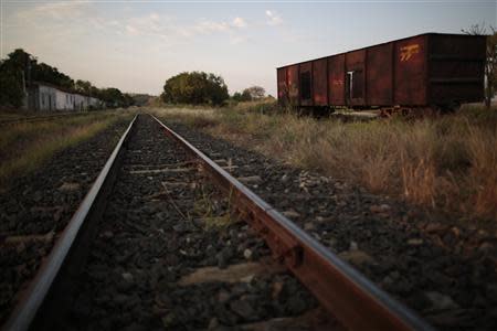 An abandoned train wagon is pictured on the tracks of the Goias Railroad, a little used train line built more than 100 years ago to link cities in southwestern Brazil, in Calambau, Goias State, September 26, 2013. REUTERS/Ueslei Marcelino