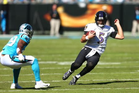 FILE PHOTO: Oct 28, 2018; Charlotte, NC, USA; Baltimore Ravens quarterback Joe Flacco (5) slides in the first quarter against the Carolina Panthers at Bank of America Stadium. Jeremy Brevard-USA TODAY Sports