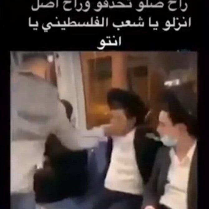 TikTok screen grab showing an Arab man slapping a yeshiva student on the light rail Jerusalem - TikTok