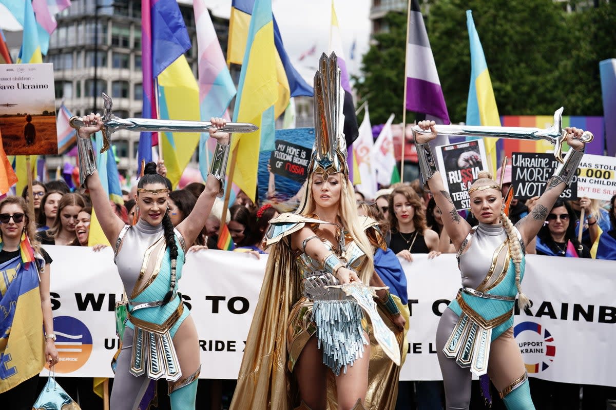 Performers take part in the Pride in London parade last year (PA)