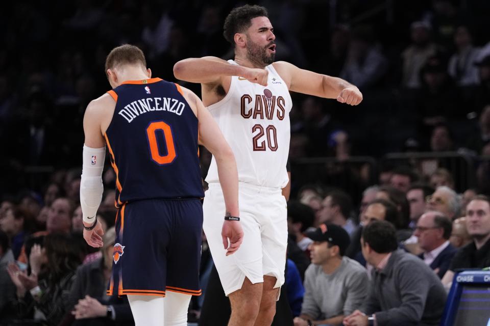 Cleveland Cavaliers' Georges Niang (20) celebrates after Donovan Mitchell scored during the second half of an NBA basketball game as New York Knicks' Donte DiVincenzo (0) looks down Wednesday, Nov. 1, 2023, in New York. The Cavaliers won 95-89. (AP Photo/Frank Franklin II)