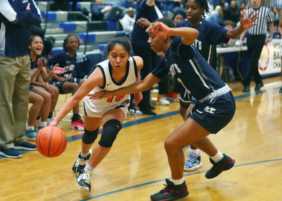 White Plains' Ineivi Plata (10) drives to the basket against Saint Mary's during the New York State Federation Tournament at  Shaker High School in Colonie March 25, 2023.