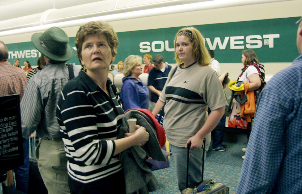 Passengers wait in line at the low-cost carrier Southwest Airlines ticket counter&nbsp;at Orlando International Airport in Orlando, Florida on Dec. 13, 2002.&nbsp;