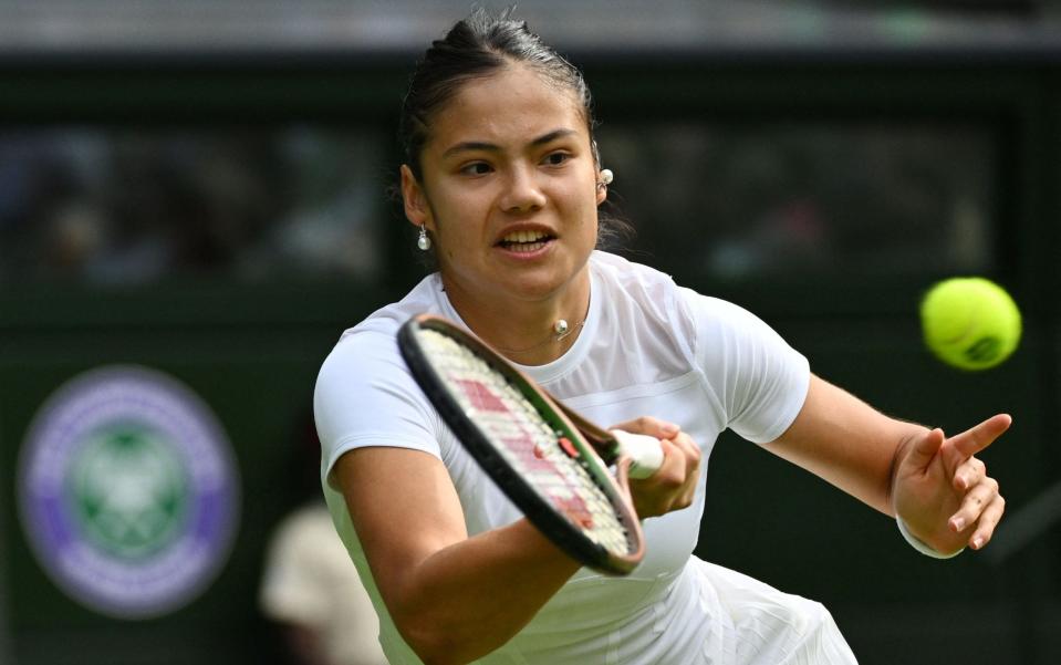 Britain's Emma Raducanu returns the ball to France's Caroline Garcia during their women's singles tennis match on the third day of the 2022 Wimbledon Championships - SEBASTIEN BOZON/AFP via Getty Images) 