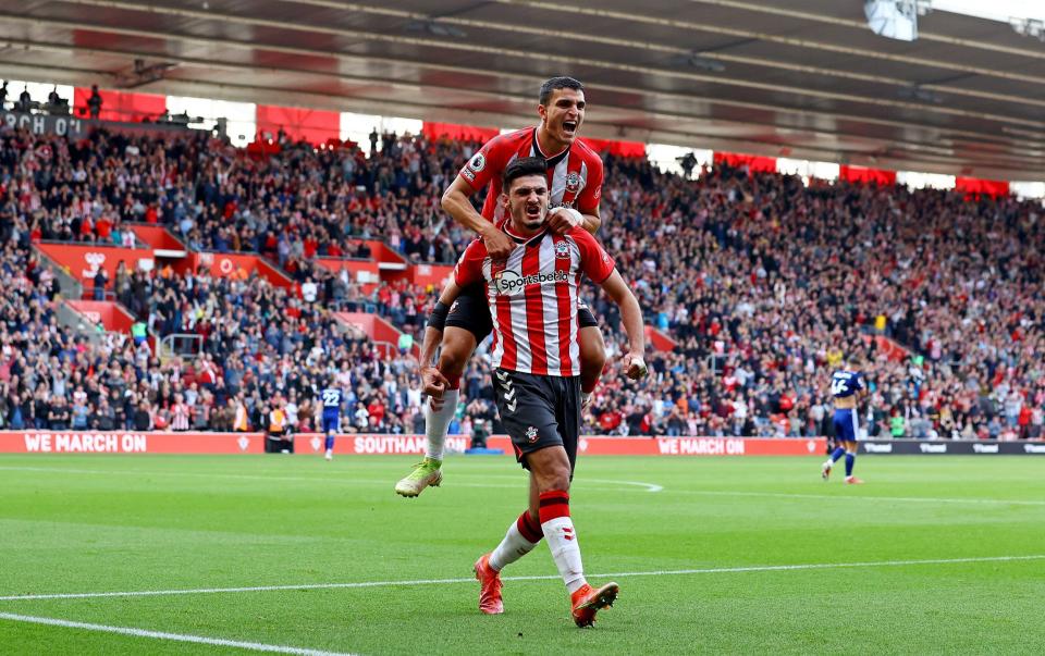 Armando Broja of Southampton celebrates after scoring as team mate Mohamed Elyounoussi jumps on his back to join him during the Premier League match between Southampton and Leeds United at St Mary's Stadium on October 16, 2021 in Southampton, England. - GETTY IMAGES