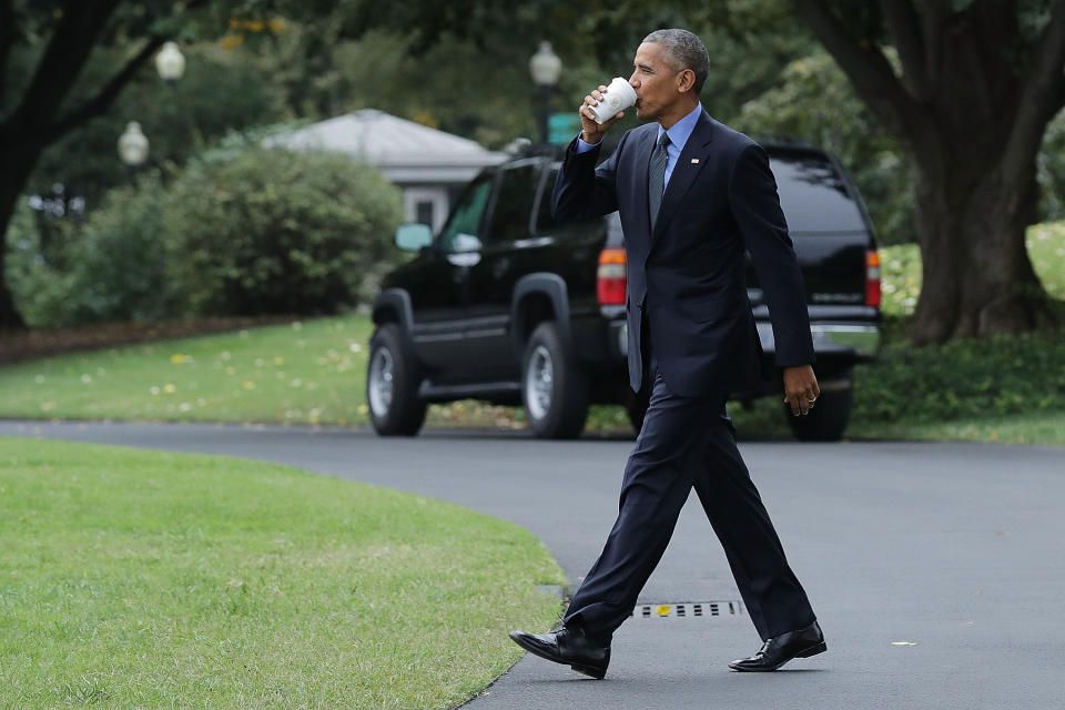 Barack Obama takes a sip of tea as he walks across the South Lawn in 2016. (Photo: Chip Somodevilla via Getty Images)