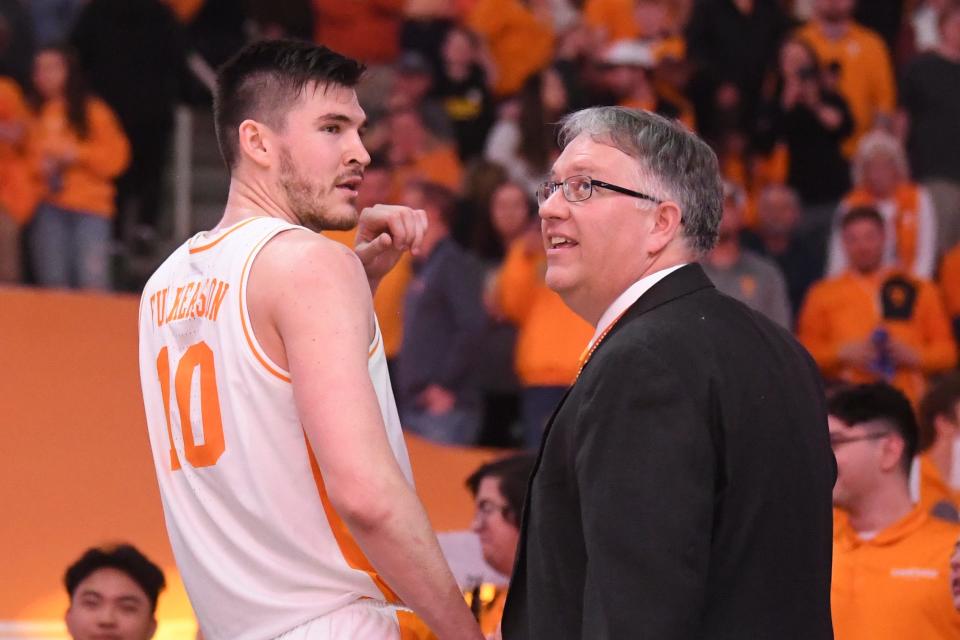 UT Pep Bands conductor Michael Stewart stands with basketball player John Fulkerson to conduct u0022Rocky Topu0022 after a basketball game between Tennessee and Auburn in February. Stewart was named the next director of the Pride of the Southland Marching and Athletic Bands.