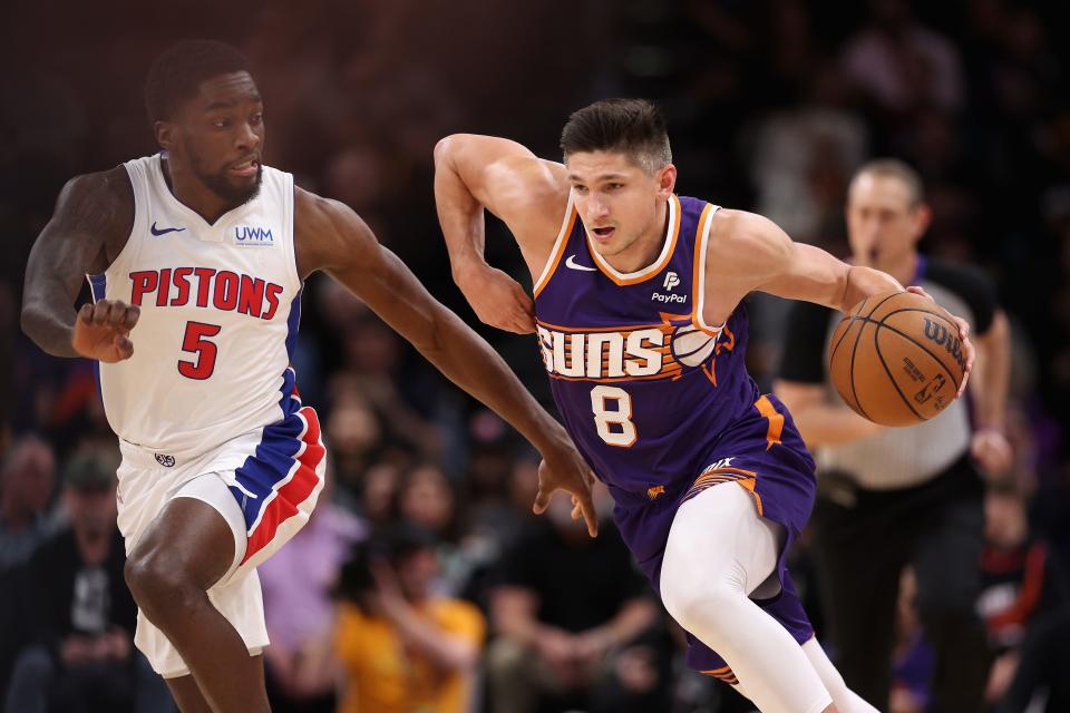 Grayson Allen #8 of the Phoenix Suns drives the ball past Shake Milton #5 of the Detroit Pistons during the second half of the NBA game at Footprint Center on Feb. 14, 2024 in Phoenix.