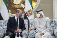 This photo made available by the Ministry of Presidential Affairs, shows Prince William, The Duke of Cambridge, left, offering condolences to Sheikh Mohamed bin Zayed Al Nahyan, President of the UAE and Ruler of Abu Dhabi, on the passing of Sheikh Khalifa bin Zayed Al Nahyan, the late President of the UAE, at the Presidential Airport in Abu Dhabi, UAE, Monday, May 16, 2022. (Hamad Al Kaabi/ Ministry of Presidential Affairs via AP)