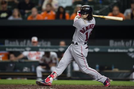 Sep 18, 2017; Baltimore, MD, USA; Boston Red Sox left fielder Andrew Benintendi (16) hits a two-run RBI single in the eleventh inning against the Baltimore Orioles at Oriole Park at Camden Yards. The Red Sox defeated the Orioles 10-8. Mandatory Credit: Patrick McDermott-USA TODAY Sports