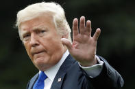 RETRANSMISSION TO CORRECT DATE - FILE - In this Sept. 20, 2018 file photo, President Donald Trump waves as he walks to Marine One on the South Lawn of the White House, in Washington. President Trump challenged the woman accusing his Supreme Court nominee of sexual assault by name, Friday, Sept. 21, 2018, saying that if the alleged attack was that "bad" then she would have filed charges. (AP Photo/Alex Brandon)