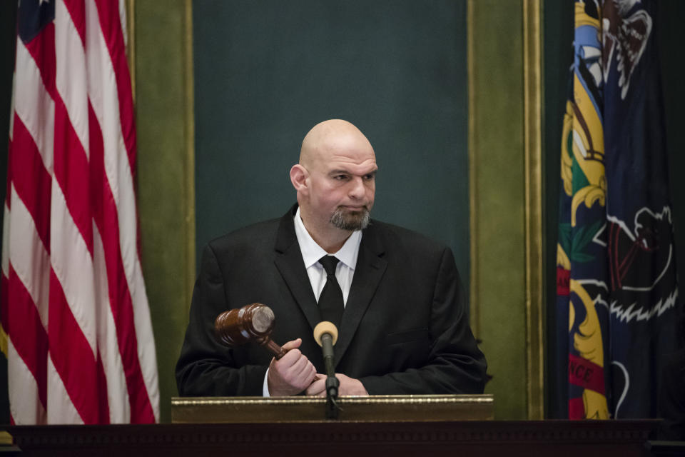 FILE - Pennsylvania Lt. Gov. John Fetterman John Fetterman holds a gavel after he was sworn into office on Jan. 15, 2019, at the state Capitol in Harrisburg, Pa. In 2019, Fetterman's first year in office, he regularly attended ribbon cuttings and conducted a statewide listening tour focused on legalizing marijuana. (AP Photo/Matt Rourke, File)