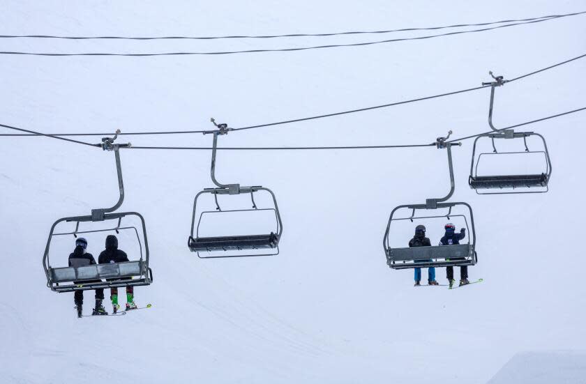 Mammoth Lakes, CA - March 14: Skiers ride chair 6 on a blustery day at Mammoth Mountain on Thursday, March 14, 2024 in Mammoth Lakes, CA. (Brian van der Brug / Los Angeles Times)