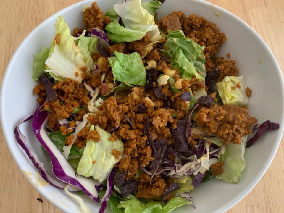 trader joe's taco salad prepared in white bowl