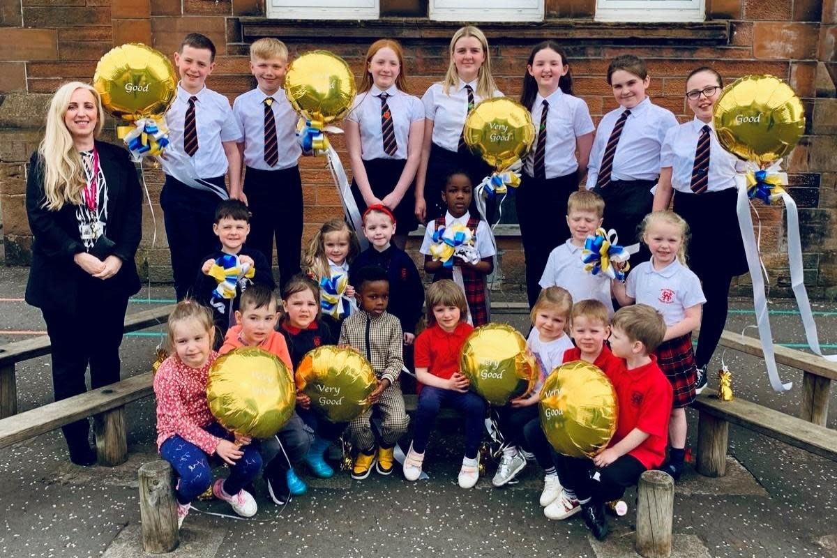 Pupils and headteacher Vhairi Cochrane celebrate after the positive inspection report <i>(Image: Williamsburgh Primary)</i>