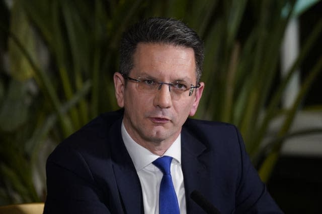 Northern Ireland minister Steve Baker in front of some plants