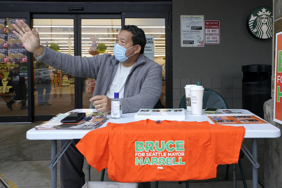 Bruce Harrell, who is running against Lorena Gonzalez in the race for Mayor of Seattle, campaigns Tuesday, Nov. 2, 2021, on Election Day at a grocery store in South Seattle. (AP Photo/Ted S. Warren)