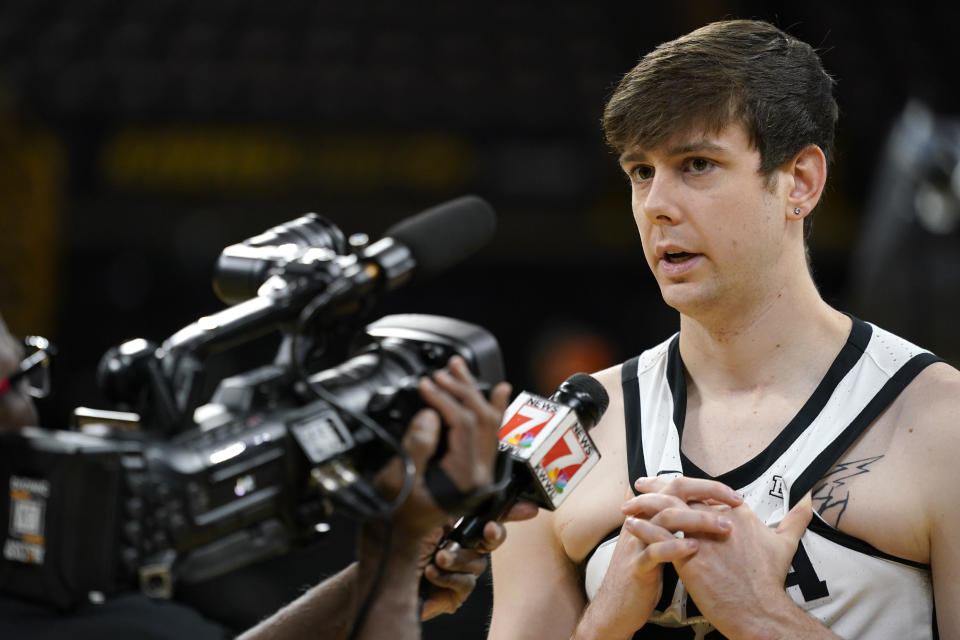 FILE - Iowa forward Patrick McCaffery is interviewed during Iowa's NCAA college basketball media day, Wednesday, Oct. 5, 2022, in Iowa City, Iowa. Playing Duke in Madison Square Garden is a big deal for any college basketball player. For Iowa's Patrick McCaffery, it's even more meaningful because the game Tuesday is part of the Jimmy V Classic, which raises funds and awareness for cancer research. McCaffery has come back from thyroid cancer as a teenager to be the Hawkeyes' second-leading scorer. (AP Photo/Charlie Neibergall, File)