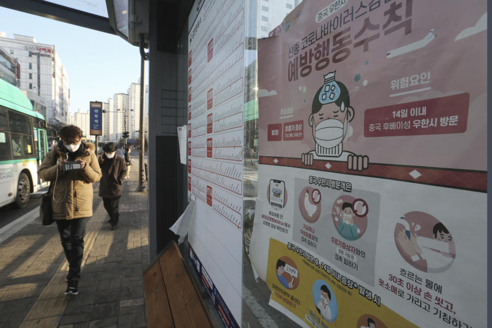 A poster detailing precautions to take against the coronavirus is seen at a bus station in Goyang, South Korea, Sunday, Feb. 23, 2020. South Korea's president has put the country on its highest alert for infectious diseases and says officials should take "unprecedented, powerful" steps to fight a viral outbreak. The signs read "Precautions against the coronavirus." (AP Photo/Ahn Young-joon)