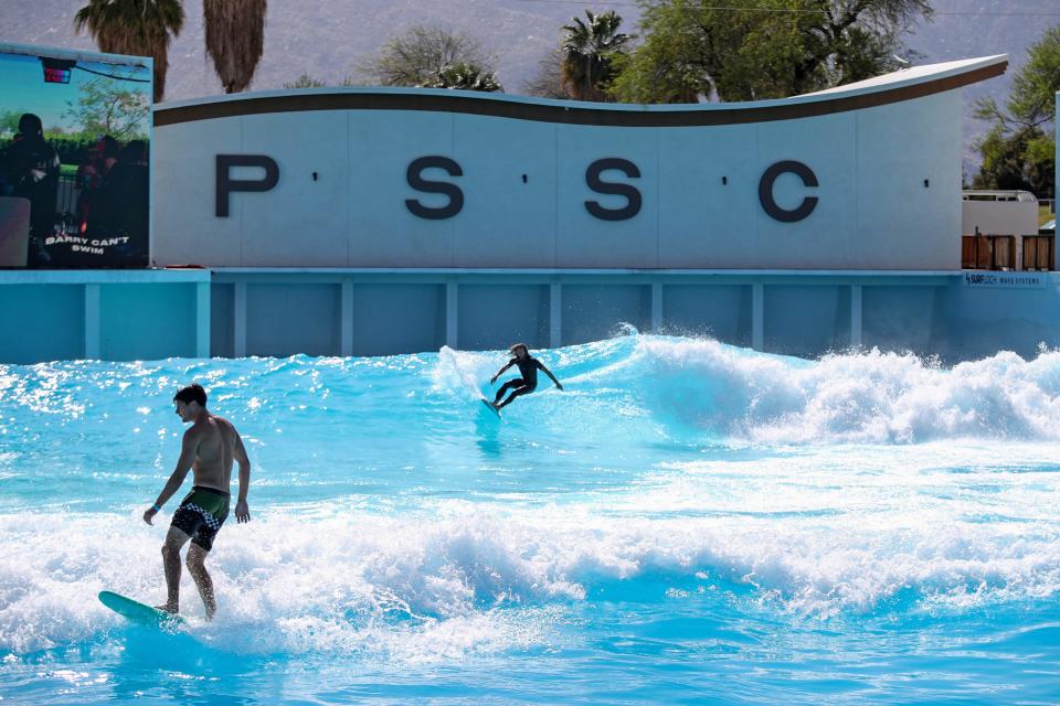 Surfers ride waves during the first-ever Goldenvoice Surf Club at the Palm Springs Surf Club on Saturday, April 13, 2024.