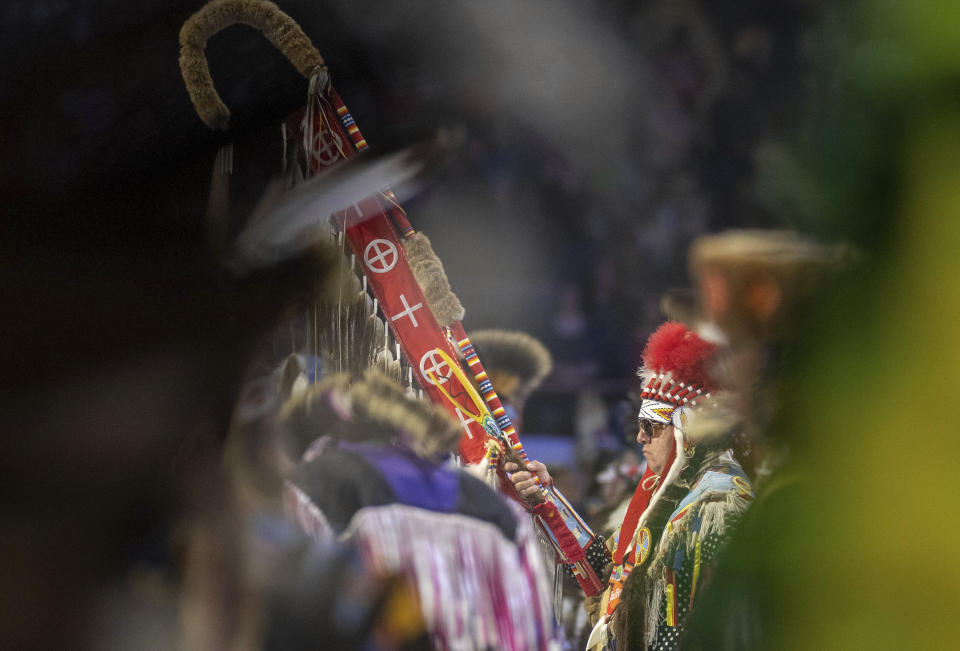 Head Man Dancer Julius Not Afraid of Rocky boy Montana leads a over a thousand dancers in the arena for the grand entry at the 40th anniversary of the Gathering of Nations Pow Wow in Albuquerque, N.M., Friday, April 28, 2023. The annual Gathering of Nations kicked off Friday with a colorful procession of Native American and Indigenous dancers from around the world moving to the beat of traditional drums as they fill an arena at the New Mexico state fairgrounds. (AP Photo/Roberto E. Rosales)