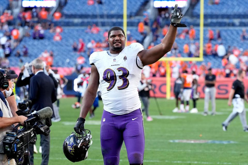 Baltimore Ravens defensive end Calais Campbell (93) celebrates after an NFL football game against the Denver Broncos , Sunday, Oct. 3, 2021, in Denver. The Ravens won 23-7. (AP Photo/David Zalubowski)