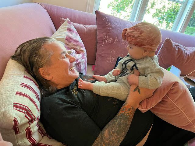 <p>Sharon Osbourne/Instagram</p> Ozzy Osbourne cuddles up to his young granddaughter, Maple, in a sweet snap shared by wife Sharon