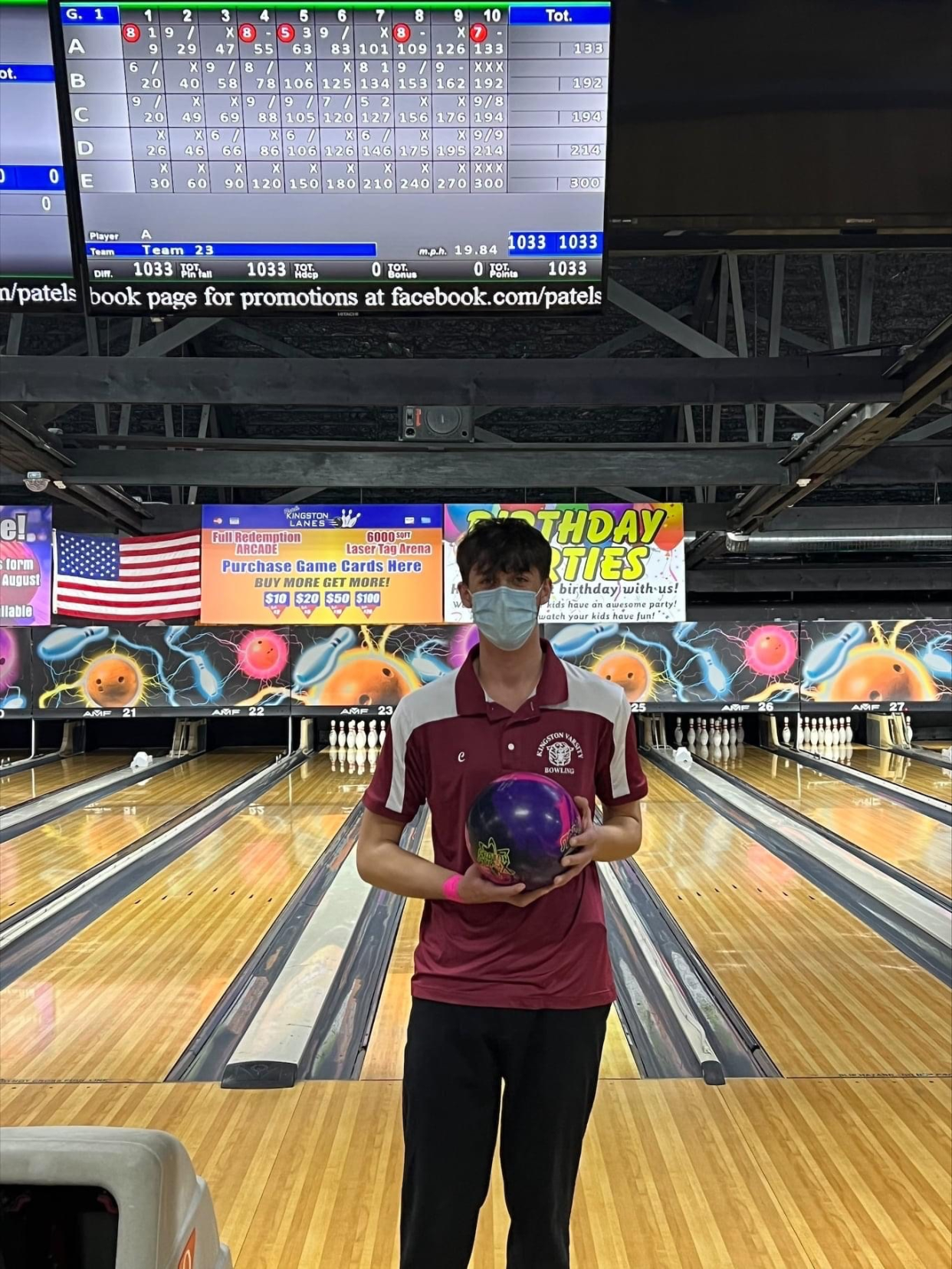 Kingston bowler Kevin Thomas poses with the scoreboard after he bowled a 300 score at Kingston Lanes in Kingston, N.Y. on Tuesday, Jan. 25, 2022.