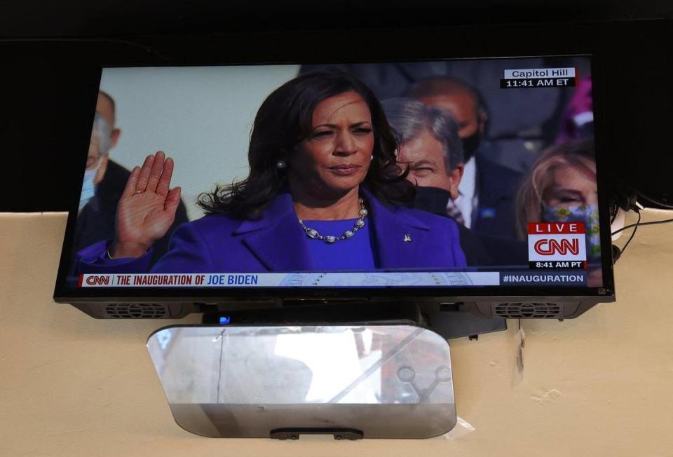 June Everett’s barber shop displays the CNN broadcast of the swearing in of Kamala Harris as Vice President of the United States as she, her staff, and customers watched this historic Inauguration. On Wednesday, January 20, 2021 Barbados-born barber shop owner June Everett watches along with customers and employees the Inauguration of President-elect Joe Biden and Vice President-elect Kamala Harris as the nation’s first Hispanic Supreme Court justice, Sonia Sotomayor swears in the first African-American woman of Caribbean and East Asian descent as vice president of the United States. Everett barber shop is in the heart of the U street just few block alway from HBCU, Howard University, where Vice-President Kamala Harris went to college.