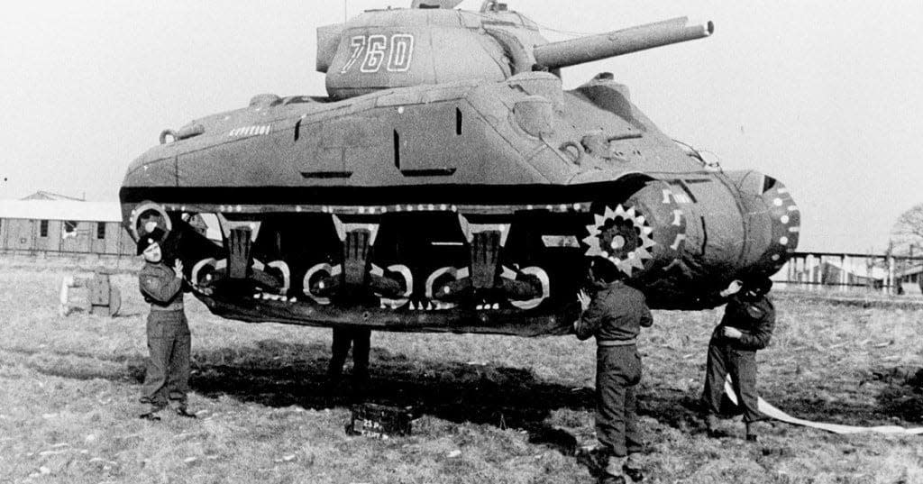 Four Soldiers assigned to the 23rd Headquarters Special Troops — commonly referred to as the Ghost Army — move an inflatable tank. The 1,100 Ghost Army service members used a variety of unique deception tactics to fool the enemy in World War II. Besides inflatable dummy equipment, they incorporated sound effects, radio trickery and impersonation. Their efforts were classified until 1993, but are now being highlighted and taught via the Ghost Army Legacy Project. (Photo courtesy of the National Archives/Fort Leonard Wood)