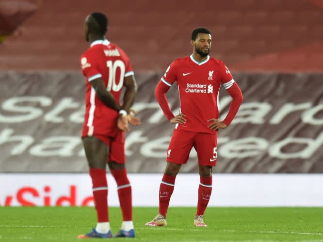 Liverpool’s players react during defeat by EvertonLiverpool FC via Getty Images